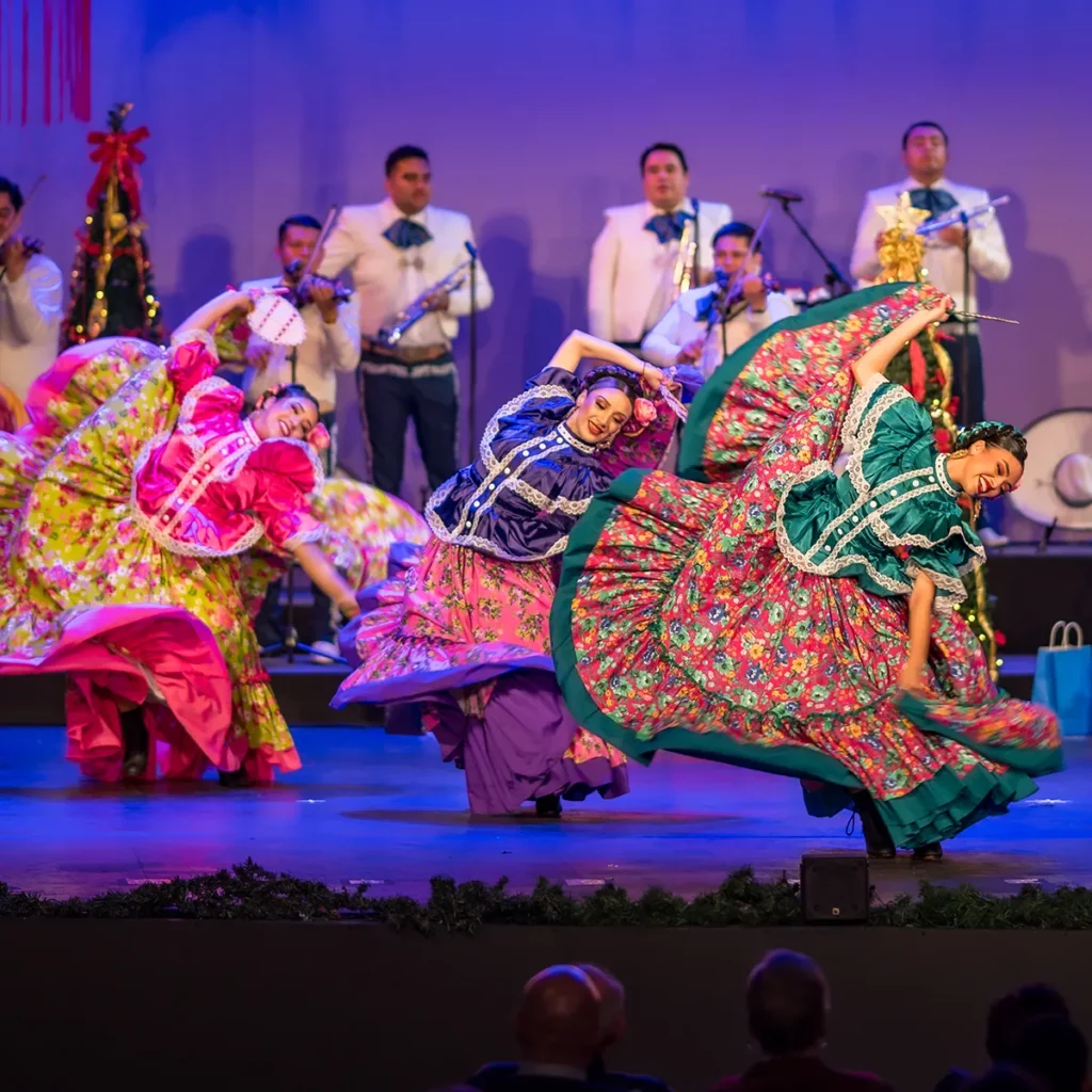Ballet Folklórico performers dance on stage at Laxson Auditorium.